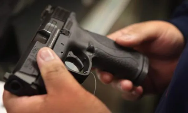 Hands holding a handgun
